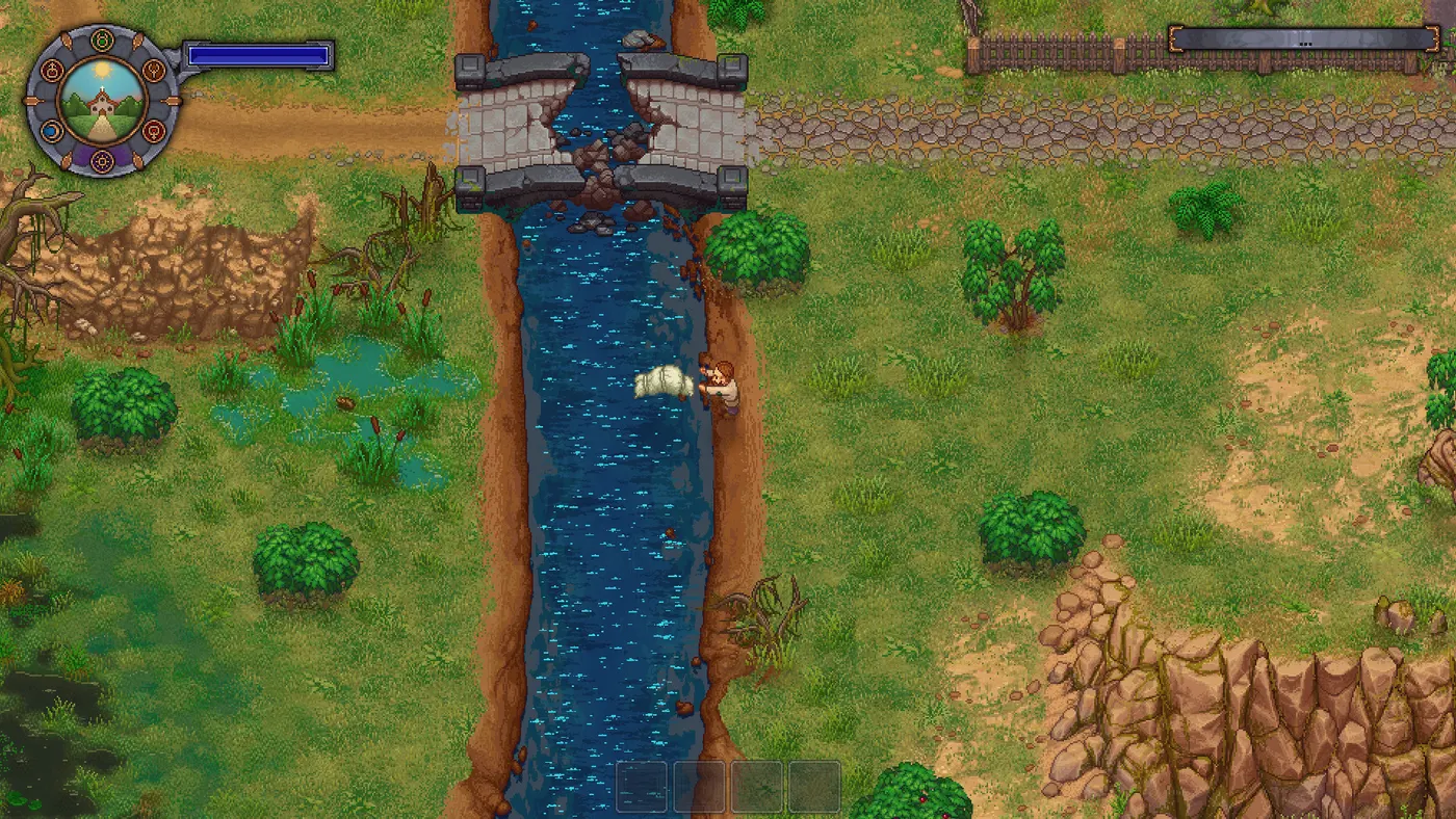 Une rivière traverse la carte de Graveyard Keeper du nord au sud, franchie par un pont de pierre en partie effondré ; berge herbeuse et buissons à gauche, roche nue à droite.
